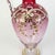 A gilded metal liquor set with a flower vase, from the late 19th century. The glass consists of a mirrored top held by a...