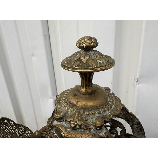 Superb antique solid brass fire screen, richly decorated in a style reminiscent of an openwork fan, featuring floral...