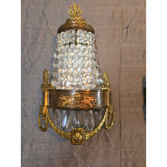 A museum quality antique french empire pair of bronze wall applique and or sconces wall lights. Having never been wired...