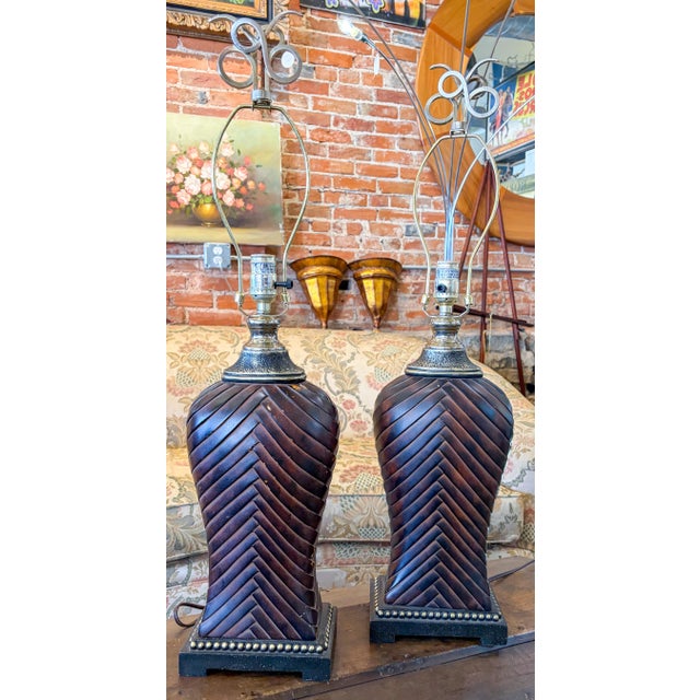 Pair of table lamps with woven pattern and matching fineals Height 31.5" Width 7.5" Depth 4.75"