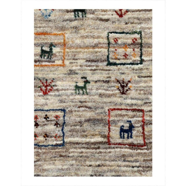 Gabbeh rugs are made by the nomadic Qashqai tribes of southern Iran. They are rough cut and long piled rugs of rich color...