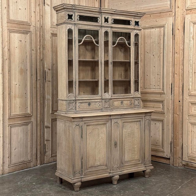 This 19th century Liégeoise bookcase embodies the quiet confidence of the Neoclassical tradition~balanced, architectural,...