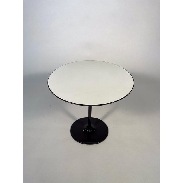 Dizzie side table designed by Lievore Altherr Molina for Arper, made in Italy. This elegant table features a white...