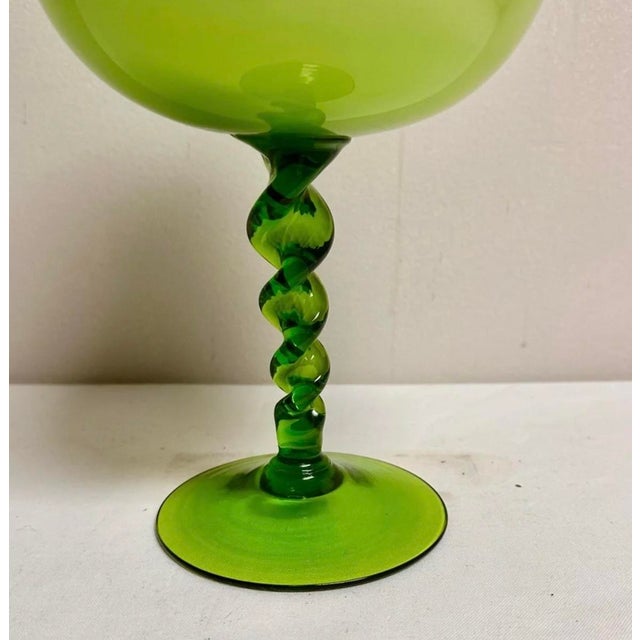 Vintage 60's era chartreuse lime green cased glass footed vase with twisted stem will be a vibrant addition to any space....
