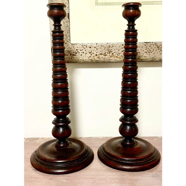 Superb pair of finely turned, matched pair of candlestick holders. Circa 19th century.