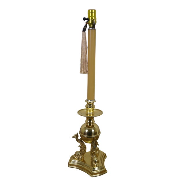 Vintage brass table lamp featuring a trio of delphins / dolphins / Koi fish supporting an orb and candlestick light....