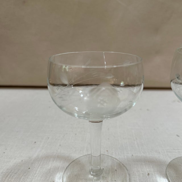 Up for consideration is a beautiful pair of champagne glasses with geometric rose designs. These would look lovely in your...