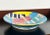Fabulous vintage c.1980's colorful wall charger, with brilliant bright electric blue, yellow, pink, and rainbow metallic...