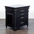 This Aspen Home end table features a stylish black finish, decorative metal drawer handles, and detailed carvings. It...