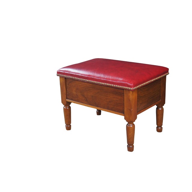 Antique oak stool / ottoman / bench / foot rest featuring red leather top with nailhead trim, turned legs and a secret...