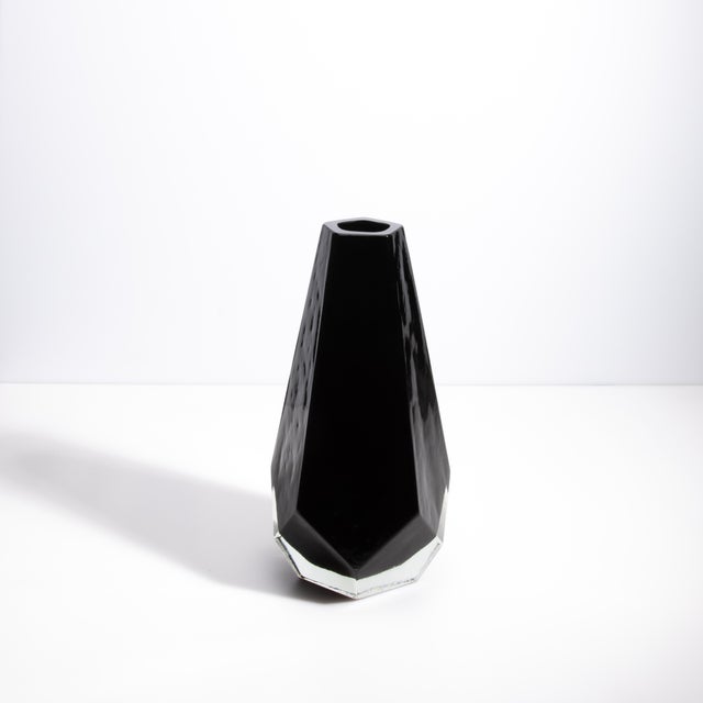 An epitome of refined elegance and superior craftsmanship, this remarkable piece features a sleek, pentagonal silhouette,...