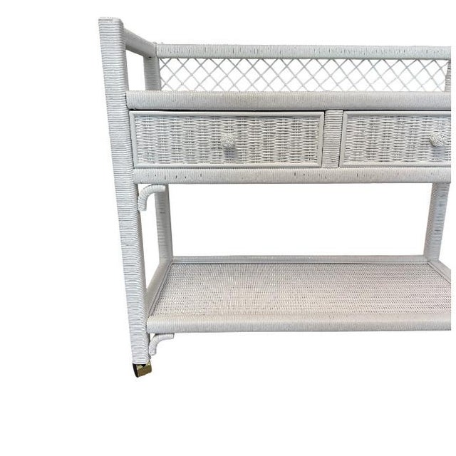 Chic Rattan Bar Cart with Glass Top and Storage Elevate your hosting experience with this stylish and functional rattan...