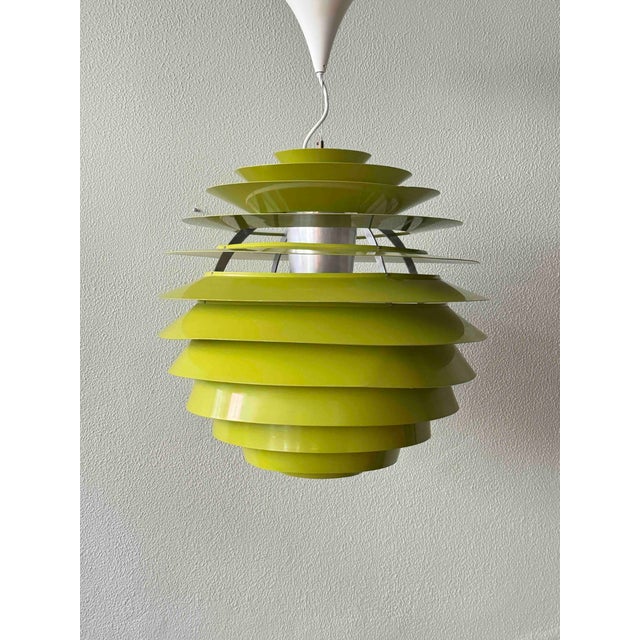 This exceptional ph louvre pendant by poul henningsen is a rare sculptural example of danish lighting design at its most...
