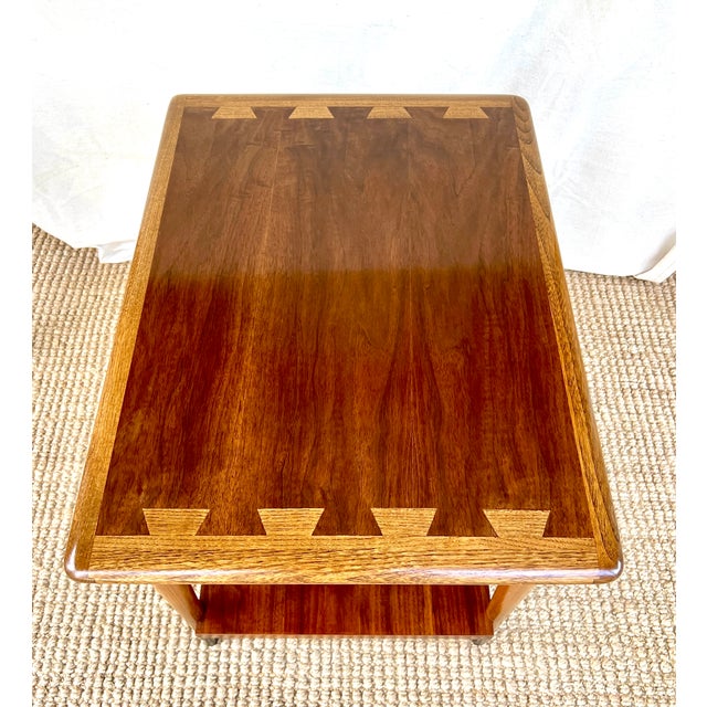 A pair of Lane Acclaim designed by Dutch designer Andre Bus. Tops of walnut and ash veneers in a faux dovetail inlay...