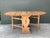 This vintage drop leaf dining table is a masterclass in rustic functionality and Early American charm. Hand-crafted from...