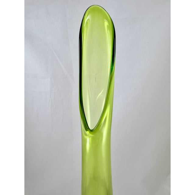 This swung vase is from the sixties. There are various shades of green, from emerald green to a yellowish green sitting a...