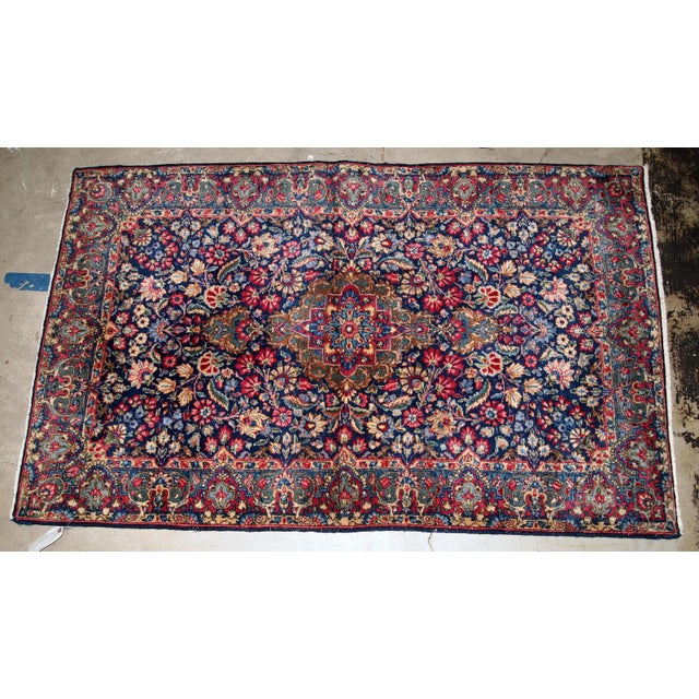 Handmade antique Kerman rug from the beginning of 20th century. The rug is in original good condition made in colorful...