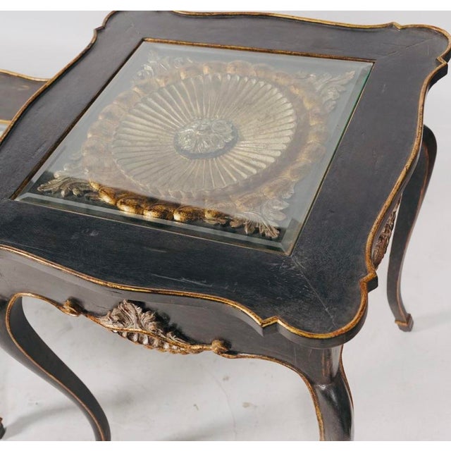A jewel-box end table with a beveled-glass window revealing an ornate gilt and silvered wheel medallion. Description:...