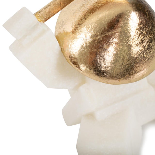 Add a playful edge to your space with these modern warrior sculptures, featuring white geometric forms and gold accents....