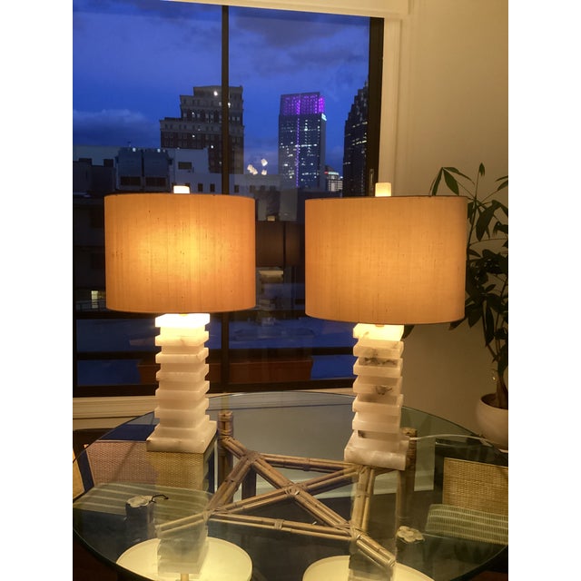 A striking pair of sculptural stacked alabaster table lamps by John-Richard, showcasing the brand’s signature blend of...