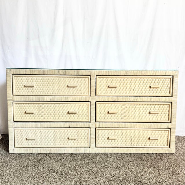 This Boho Chic white washed wicker dresser embodies relaxed coastal elegance with a timeless resort-inspired presence....