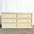 This Boho Chic white washed wicker dresser embodies relaxed coastal elegance with a timeless resort-inspired presence....