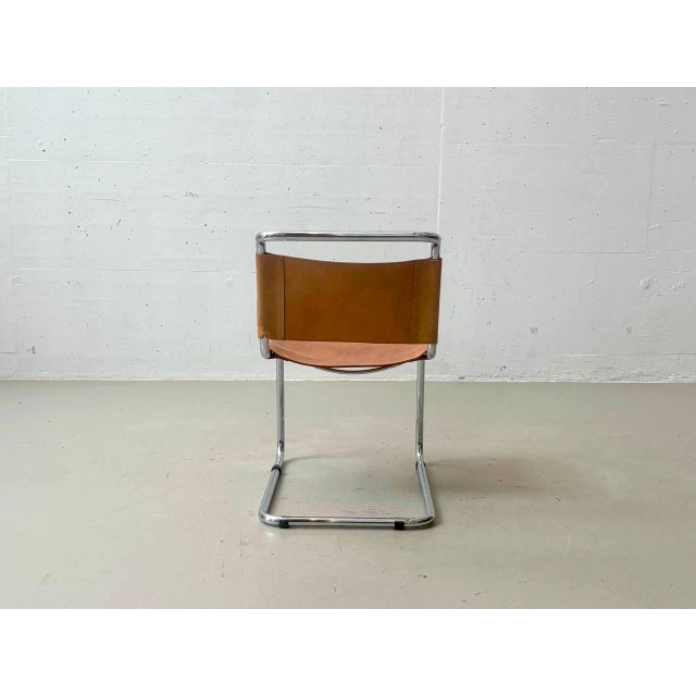 The chairs shown are cantilever chairs with a distinctive material and design language clearly rooted in the Bauhaus...