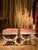 This pair of 19th century Italian Louis XVI style lacquered and parcel gilt stools, designed with exceptional attention to...
