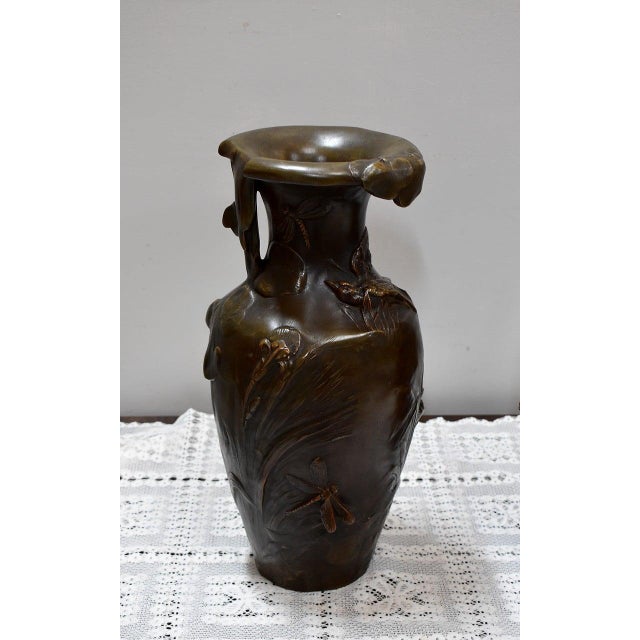 Pair of patinated regula vases signed Auguste Moreau* (1834 - 1917) and stamped 'French Manufacturing'. They feature a...