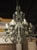 Metal A French Patine Vert Wrought Iron and Tole 8-Light Chandelier, 20th Century For Sale - Image 7 of 18