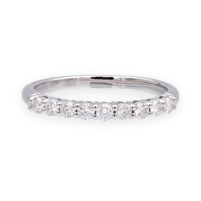 This Tiffany & Co. Forever diamond band is crafted in solid platinum and set with nine round brilliant diamonds across the...