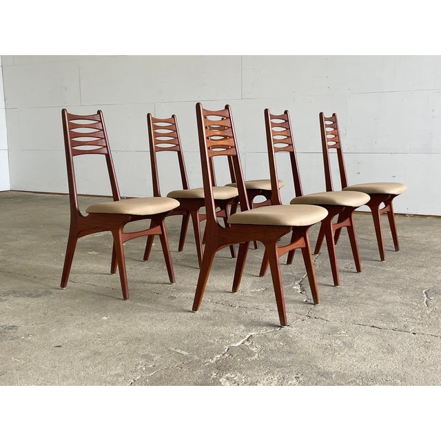 A distinguished and sculptural set of six Danish mid-century teak dining chairs produced by Boltinge Stolefabrik — one of...