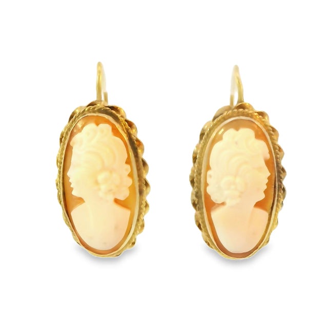These antique estate 14K yellow gold shell cameo drop earrings are a timeless statement of vintage elegance. Each earring...