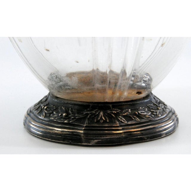 Silver Wine Jug with Cut Glass, Knob on the Lid and Relief with Floral Motifs, in Very Good conditions. Designed before...