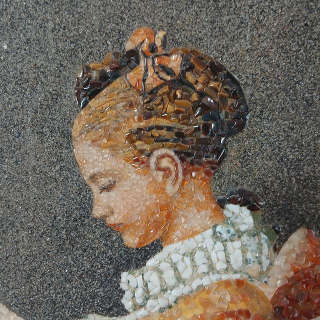 A lovely and exotic rendering of Fragonard's famous depiction of a young girl engrossed in her book. The gemstones glisten...
