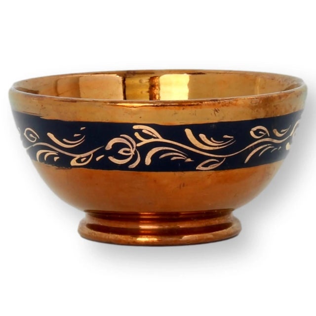 Antique English copper lustre bowl with dark blue enameling. Made circa 1880. No maker's mark.