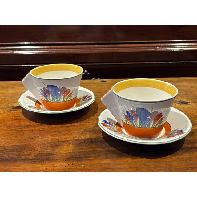 Clarice Cliff Design Crocus Pattern Tea Cups & Saucers. Box with Certification 2 cups 2 saucers Sizes :- cups 7 cms talk,...