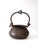 Antique hand-hammered copper hearth pot with a softly rounded form and rich, aged patina developed through time and use....