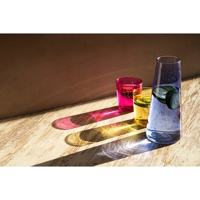 <p><em>CMYK</em> is a set of carafe and 2 glasses that plays with light and overlapping colours. Designed by OJEAM Studio...