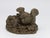 This remarkable mid-20th century English garden ornament captures the essence of a quiet moment of a squirrel in a garden....
