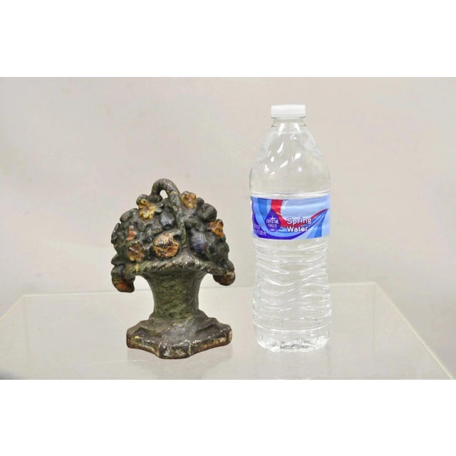 Antique Victorian Cast Iron Small Painted Orange Floral Bouquet Basket Door Stop. Circa Early 20th Century. Measurements:...