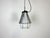 Industrial factory hanging lamp made by Polam Wilkasy in Poland during the 1970s. It features a grey hammerpaint aluminium...