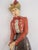 Lady golfer cast metal doorstop in vintage attire. Brightly colored all over hand painting with chip wear to the finish....
