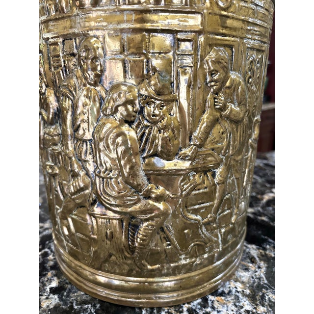 Such a gorgeous piece of craftsmanship! This brass, embossed container depicts a tavern scene, possibly from a Dutch or...