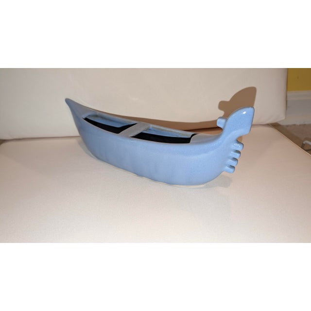 Blue gondola ceramic planter, no maker's mark. One interior compartment. No damage. Dimensions: 4 1/2 X 12 X 2 5/8.