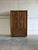This striking armoire dresser features the iconic, heavily textured Brutalist relief pattern. Behind its double doors,...