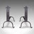 This is a pair of antique fire dogs. An English, blacksmith made wrought iron fireplace andiron with Gothic overtones,...