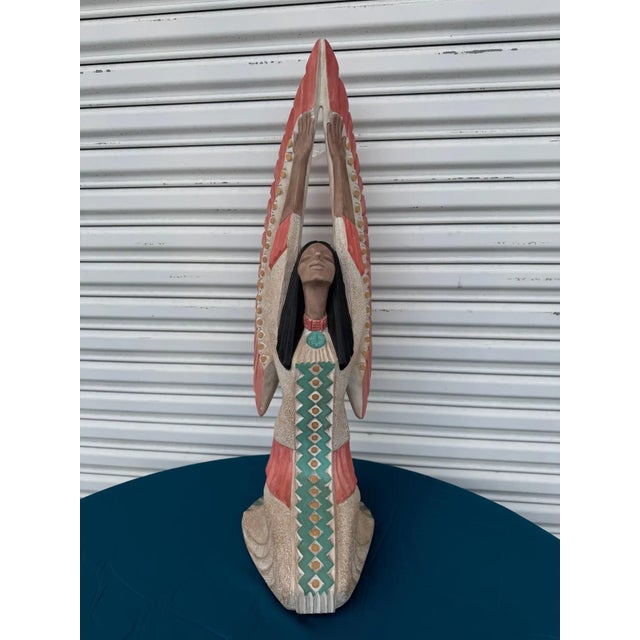 This is a composite sculpture by Austin Productions depicting a native American Acoma tribe woman. It was cast in 1989.