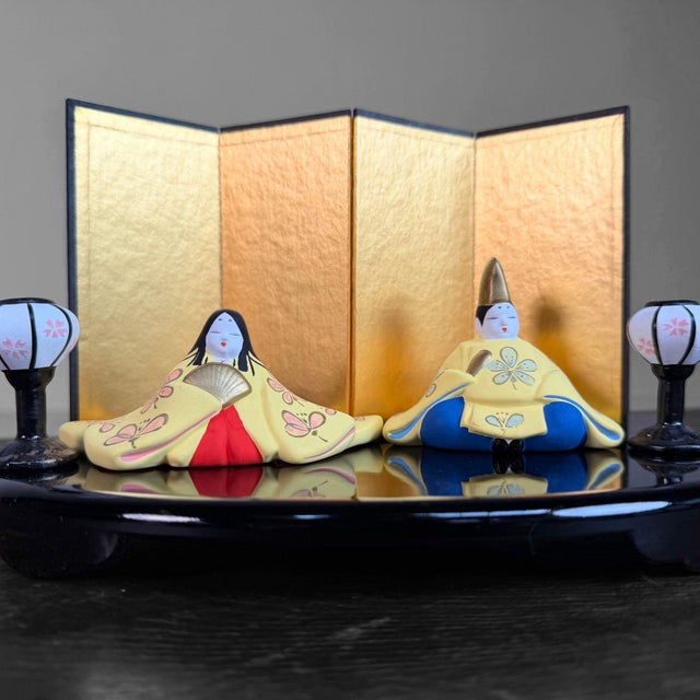 Charming Japanese Hina Ningyō set with an imperial couple, made in fine ceramic and presented on a black display platform...