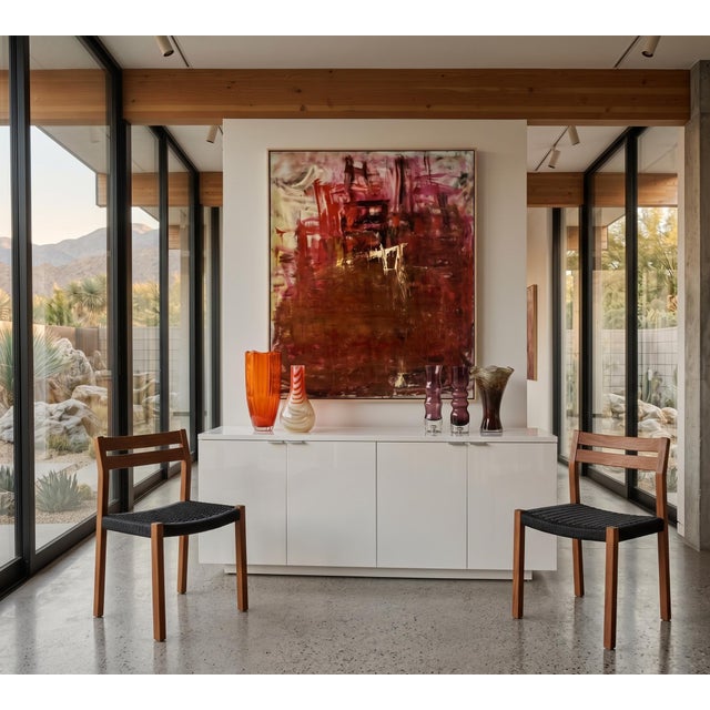 Overview & Description A pair of Model 83 dining side chairs designed by Niels Otto Møller in 1974 for J.L. Møllers...